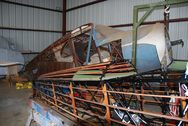 Restoring a 1935 Fairchild C8E in background